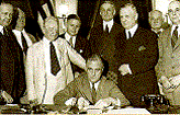 photo of Franklin D. Roosevelt signing bill