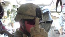 photo of a soldier showing middle finger