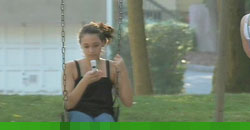 photo of a child on a swing, texting