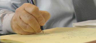 photo of a hand writing