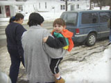 photo of brian being carried to the car