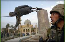 photo of saddam's statue coming down