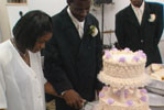 people cutting cake