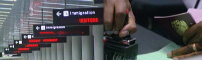 scenes of an international arrivals hall at an american airport