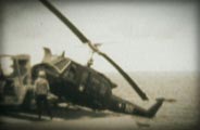 photo of a helicopter being thrown from an aircraft carrier