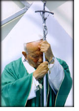 pope john paul II with his head on a cross