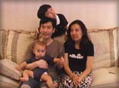 zhang wu with his wife and two children