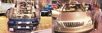 photo of a rolled-over suv and people looking at a lexus suv