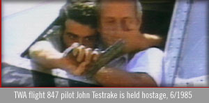 photo of a highjacker holding a TWA pilot hostage, june 1985