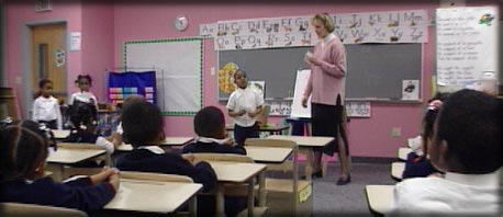 teacher and students in a hideously painted classroom