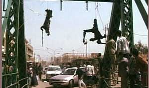 photo of contractors hanging off a bridge in fallujah, march 2004