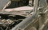 photo of a burned-out truck in iraq