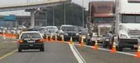 line of cars and trucks leaving new orleans